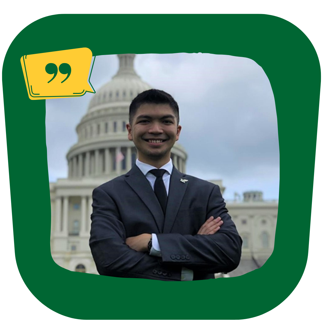 Joseph Fernando wearing a suit and standing in front of the U.S. Capitol